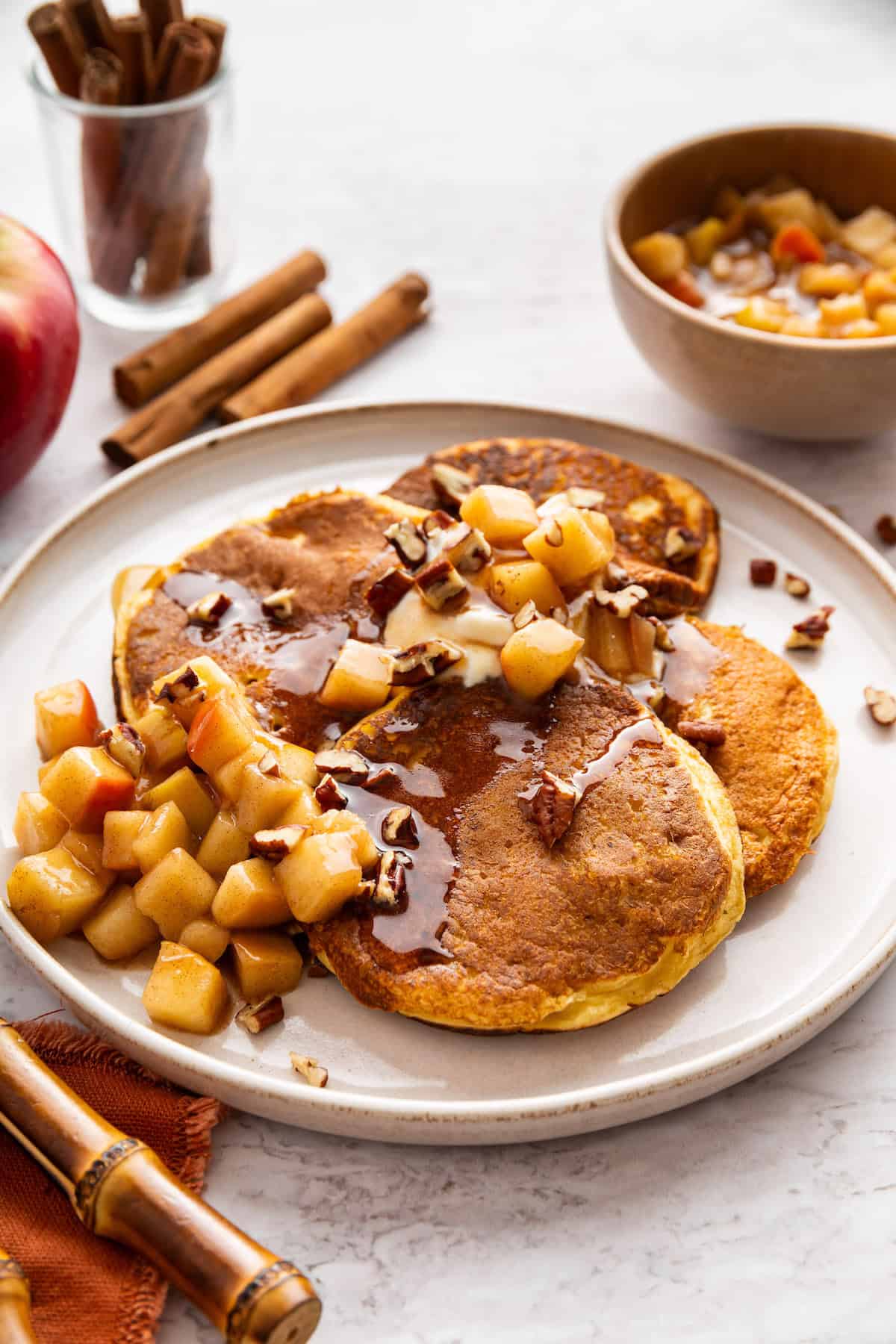 These fluffy apple cider pancakes aren't holding back on apple flavor. The apple cider really does the trick. And that hint of cinnamon? Yes! Apple cider pancakes topped with stewed apples.