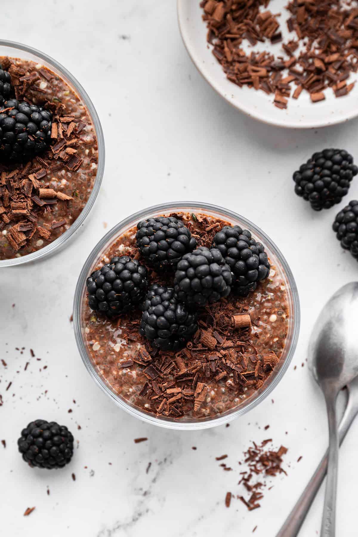 This creamy 5-ingredient chocolate chia pudding packs a powerful punch of protein and just-sweet-enough chocolate pizzaz. And it's so easy! Overhead image of creamy chocolate chia pudding in a jar.