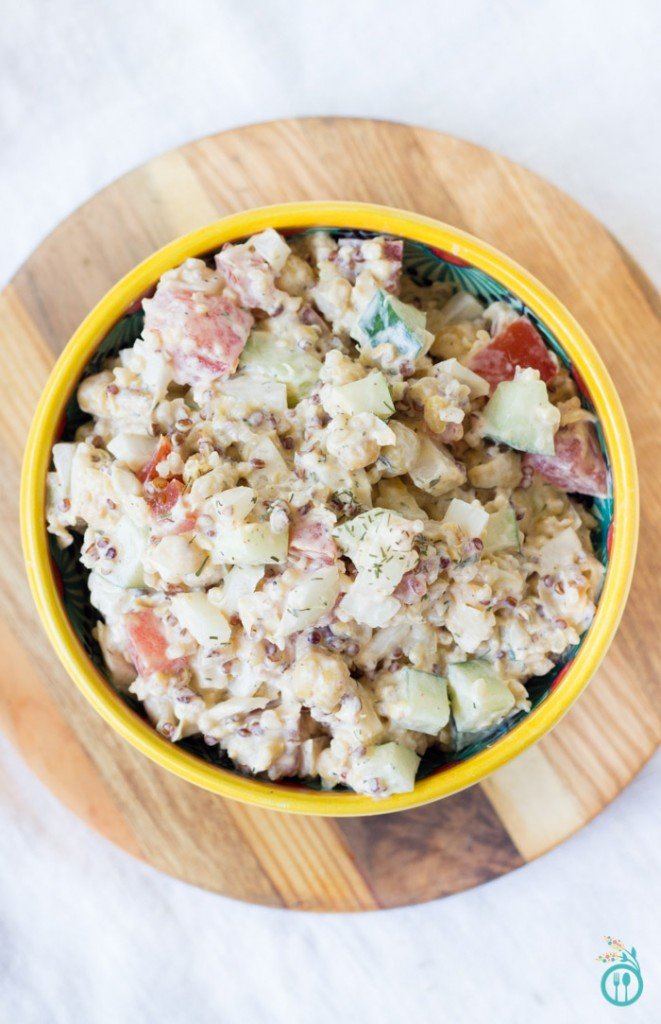 Overhead shot of a creamy vegetable side dish in a colorful bowl.